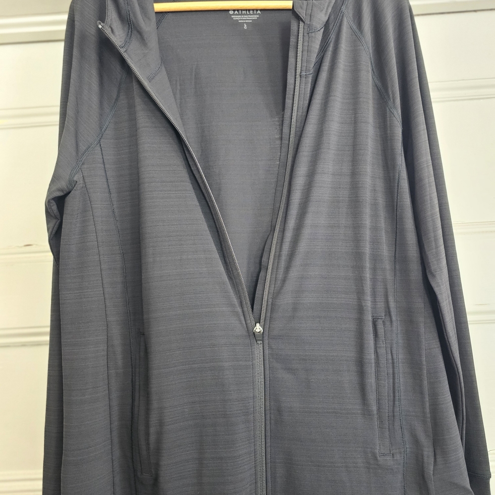 Black Athelta Pacifica Ilume Lightweight Sunprotection Jacket With Finger Holes.